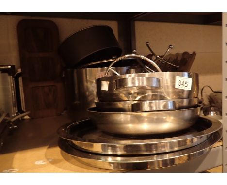 Shelf of stainless steel pans and trays 