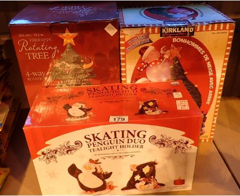 Fiber optic rotating ceramic Christmas tree light up snowmen with three and skating penguin with duo tealights 