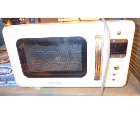White enamel Daewoo 800w microwave  CONDITION REPORT: All electrical items in this lot have been PAT tested and have PASSED. 