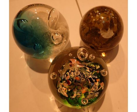 Three vintage glass paperweights including caithness