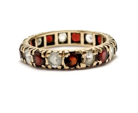 Unmarked gold red /white stone eternity ring - size J &amp; 2g total weight