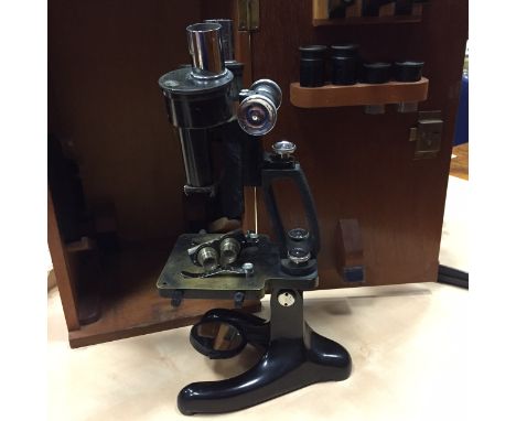 EARLY TWENTIETH CENTURY BRASS BINOCULAR MICROSCOPE
by Beck, London, ebonised finish, the base signed "Beck, London", with rac