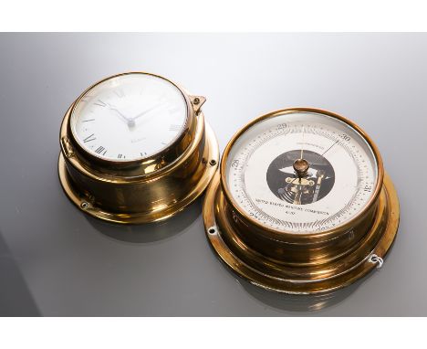 BRASS BULKHEAD UNITED STATES MARITIME COMMISSION BAROMETER
by Taylor, USA, signed silvered dial, gilt hands, 13cm diameter; t