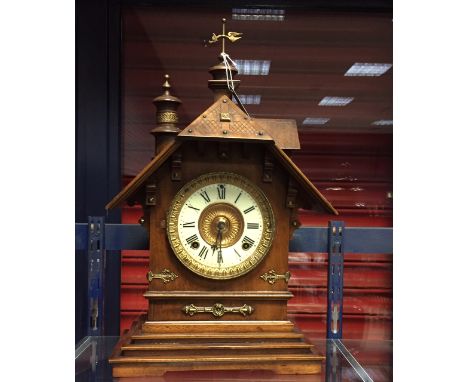 UNUSUAL AMERICAN ANSONIA CHALET STYLE OAK MANTEL CLOCK
early twentieth century, signed two train movement striking on a coile