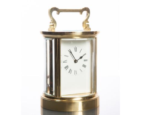 TWENTIETH CENTURY ENGLISH BRASS CARRIAGE CLOCK
by ACG, of circular form, signed single train movement with lever platform esc