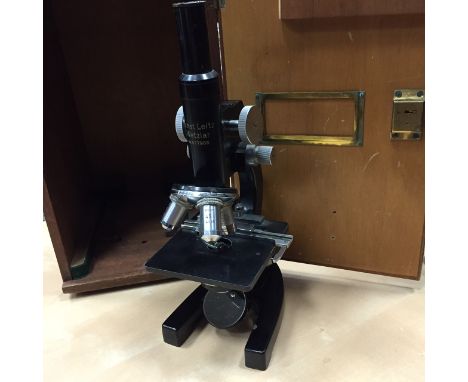MID TWENTIETH CENTURY VINTAGE MICROSCOPE
by Ernest Leitz Wetzlar, serial number 477986, with three object lenses and moving s