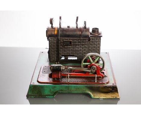 A MID TWENTIETH CENTURY MARKLIN STATIONARY LIVE STEAM ENGINE
labelled to base, composed of brass and tin plate, spirit fired,