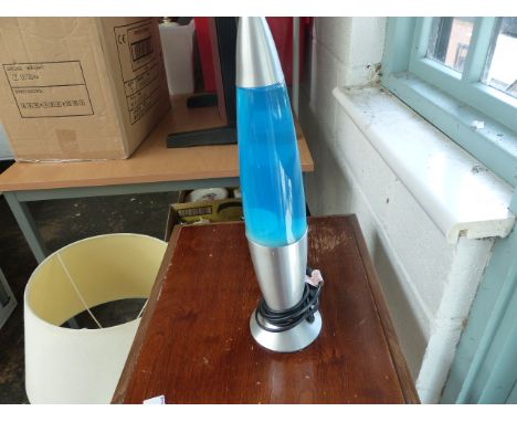 Lava lamp and two brass handled pokers