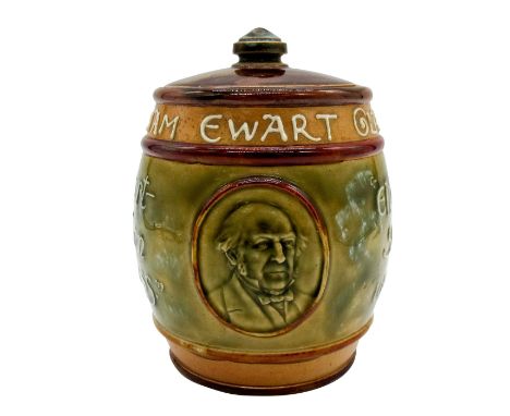 A mottoware covered jar with a portrait relief of William Ewart Gladstone. Green and brown glaze coloration.Doulton Lambeth i