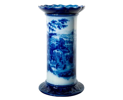 Blue and white glazed body with encircling cityscape scene. Cylindrical form; flared base and scalloped rim.Doulton Burslem b