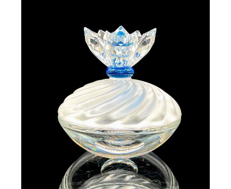 Part of the Exquisite Accents collection. A clear base with a frosted lid adorn with a clear faceted flower with a blue cryst