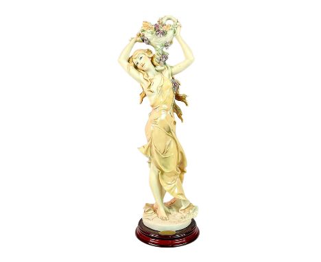 Limited edition. Matte and glossy finished figurine modeled as a beautiful woman with Roman style dress holding a swan-shaped