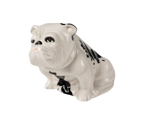 Modeled as a white seated bulldog with black fringed spots and red collar. The fringed spots form the silhouette of Great Bri
