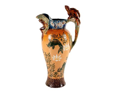 A highly decorated, antique pitcher with gold accents and fish to side.Art Pottery with underwater fish scene to panels. #sto