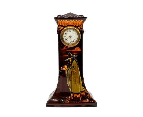 Beautiful brown with rich glaze finish. Design is raised with ochre and sage coloration on cloak and hat. Dimensions: 6"L x 3