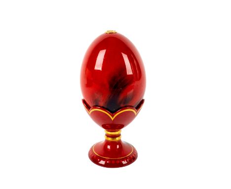 Limited edition rich red egg with blue glaze and gold gilt accents around stand.Royal Doulton Flambe backstamp and embossed o