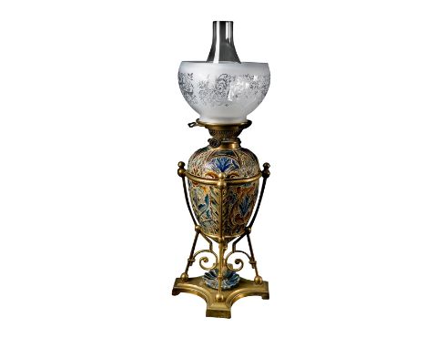 Gorgeous floral high relief decorated lamp on a brass base. Stylized rabbits on the upper part, cobalt blue and brown colorat