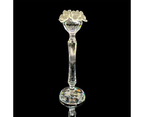 A clear long steam single candlestick holder adorn with frosted flowers. Swarovski Silver Crystal mark. This item has its ori