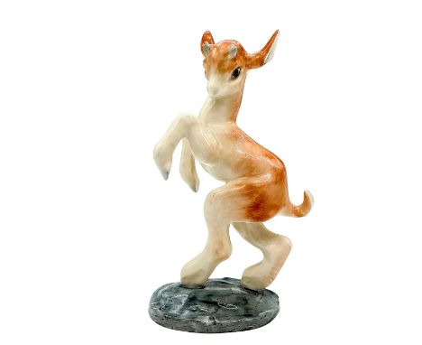 Hand painted, matt finish piece modeled as brown and white goat standing on a grey base, model no. 955. Royal Doulton backsta