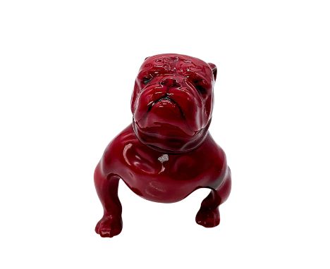 Style one, red rich glaze modeled as a seated bulldog. Model no. 38. Royal Doulton backstamp. Issued: 1912 - 1936Dimensions: 