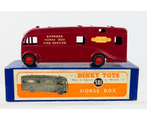 Dinky - A boxed British Railways Express Horse Box in maroon # 581. The model appears in Near Mint condition with and only a 