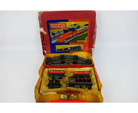 Brimtoy - Tin Plate - A tin plate clockwork train set. Contains a locomotive (67040), tender (British Railways), 2 coaches, t