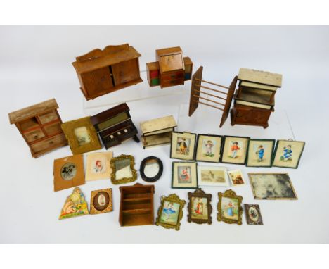 Doll Furniture - A collection of vintage dolls house items including wooden cabinets, a piano, pictures, a mirror and others.