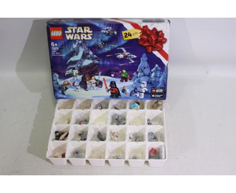 Lego - A boxed 2020 Lego #75279 Star Wars Advent Calendar. The set has a parts / pieces within 23 of the 24 compartments with