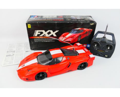 Tamiya - A boxed and built 1:10 scale Tamiya #58377 shaft driven 4WD RC Ferrari FXX (Finished Body). The model show signs of 