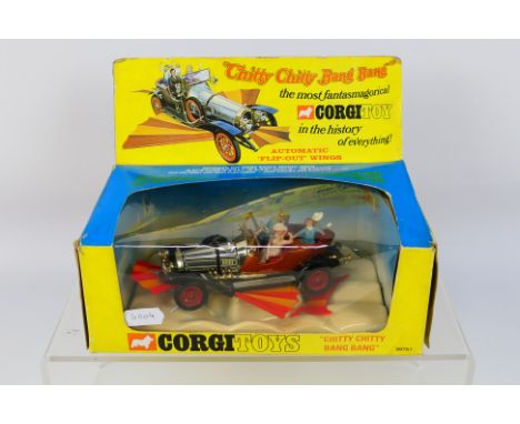 Corgi Toys - A boxed Corgi Toys #98751 Chitty Chitty Bang Bang. The model with chrome, red, brown body with retractable red a