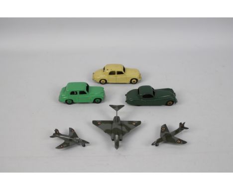 Dinky - A group of unboxed models including Jaguar XK120 in green with fawn hubs # 157, Rover 75 # 157, Hillman Minx # 40f, G