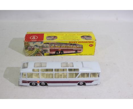 Dinky Toys - A boxed Dinky Toys #952 Vega Major Luxury Coach. The model in pale grey with maroon side flashes and cream inter