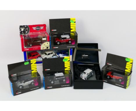 Corgi - A collection of boxed Corgi 1:43 scale diecast Minis. Lot includes Corgi G50031 Plated Anniversary Mini; #94171 Speci