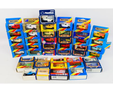 Matchbox - A boxed collection of 45 Matchbox MB38 Ford 'A' diecast promotional model vans. Lot includes 'James Neale & Sons';