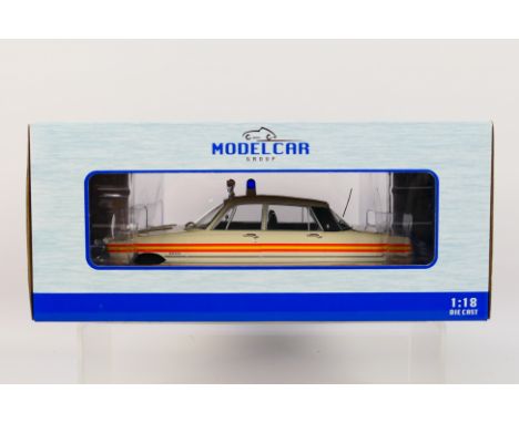 Model Car Group - A boxed 1:18 scale Model Car Group MCG18045 1974 Rover V8 Police Car. The model in white appears to be in M