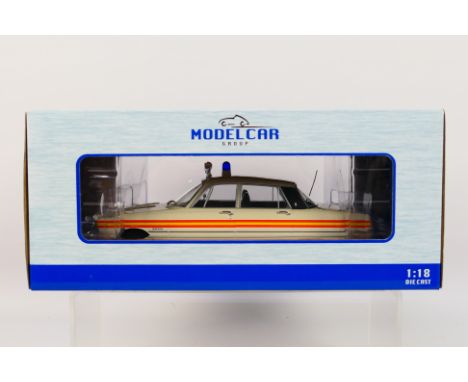 Model Car Group - A boxed 1:18 scale Model Car Group MCG18045 1974 Rover V8 Police Car. The model in white appears to be in M