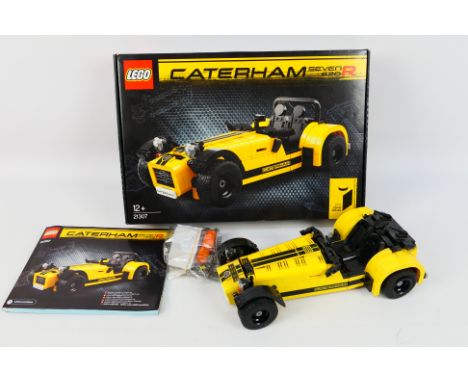 Lego - A boxed 2016 Lego #21307 Caterham Seven 620R. The model is constructed, showing dusty signs of display with some parts