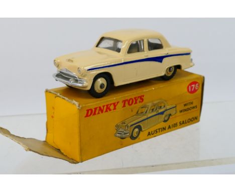Dinky - A boxed Austin A105 saloon in cream with violet side flash # 176. The car appears in Near Mint condition with origina