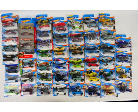 Hot Wheels - A carded collection of 45 Hot Wheels diecast model vehicles plus a Hot Wheels HW Flames 5-pack. Lot includes Por