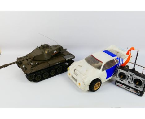 Kyosho - Heng Long - Two unboxed radio controlled models, including a Kyosho battery powered Ford RS 200; together with a Hen