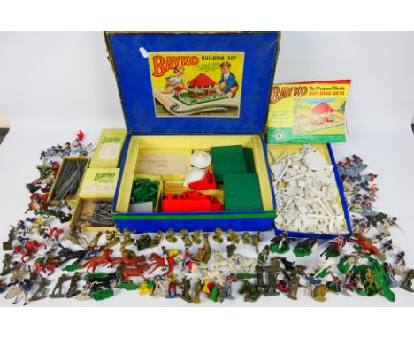 Lot comprising a Bayko Building Set No 3 (unchecked for completeness), box has been taped and a quantity of plastic soldiers 