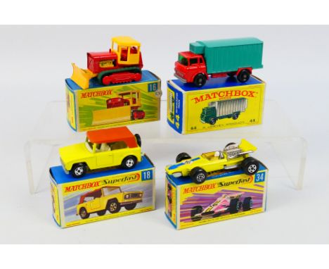 Matchbox - Four boxed Matchbox diecast model vehicles. Lot consists of Matchbox RW #16 Case Bulldozer Tractor; #44 GMC Refrig