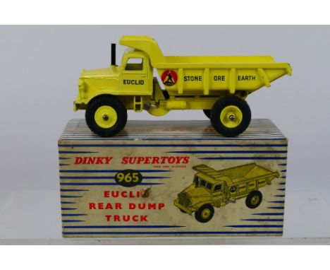 Dinky - A boxed Euclid Rear Dump Truck # 965. The truck appears in Very Good condition with signs of light use. The box is Ve