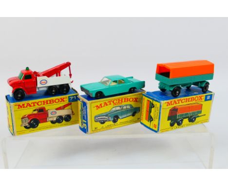 Matchbox - Three boxed Matchbox diecast model vehicles. Lot consists of Matchbox RW #2 Mercedes Trailer; RW #31 Lincoln Conti