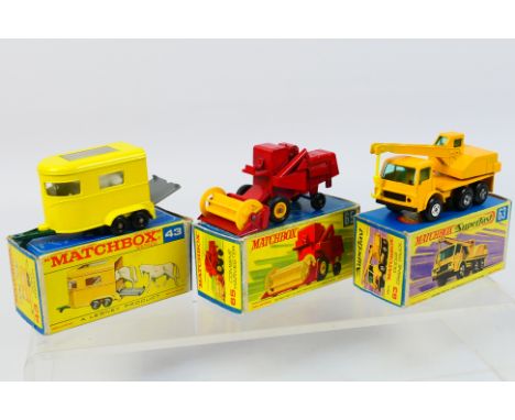 Matchbox - Three boxed Matchbox diecast model vehicles. Lot consists of Matchbox RW #43 Pony Trailer; #65 Class Combine Harve