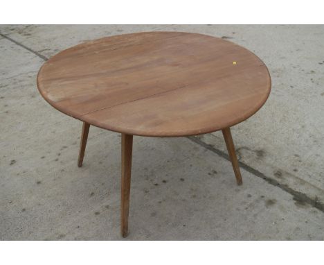 A 1960s Ercol light elm drop leaf dining table, on splay supports, 48" wide x 44 1/2" deep x 28 1/2" highCondition:Split to t