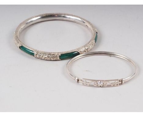 A white metal and jade bangle with bright cut engraving and a white meatal Rennie Mackintosh style bangle 