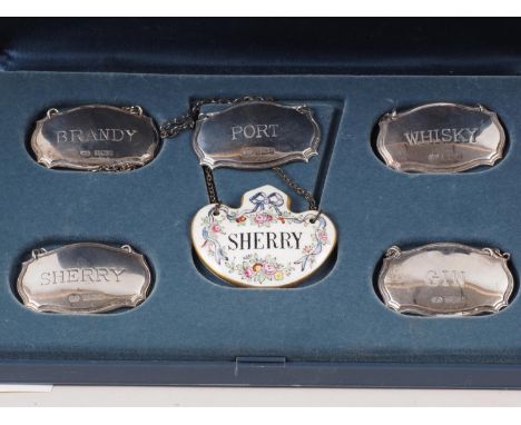 A set of five silver decanter labels and one other, 1.4oz troy approx 