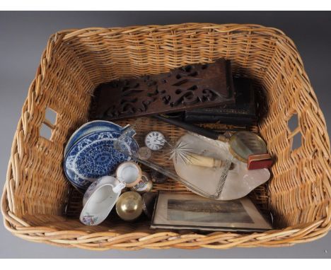 A woven wicker laundry basket, an oak book stand, a magnifying glass with horn handle, a papier-mache tea caddy (for restorat
