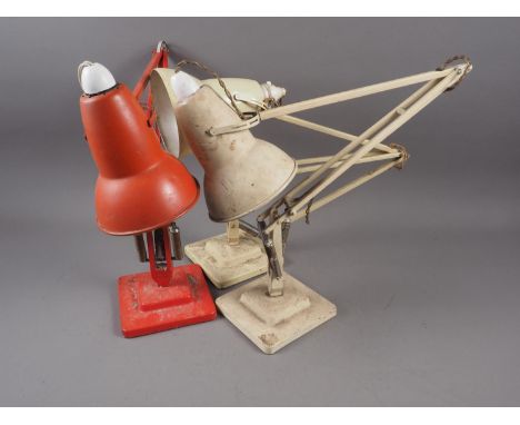 Two cream coloured Herbert &amp; Terry anglepoise lamps, on square bases, and a similar red coloured Herbert &amp; Terry angl